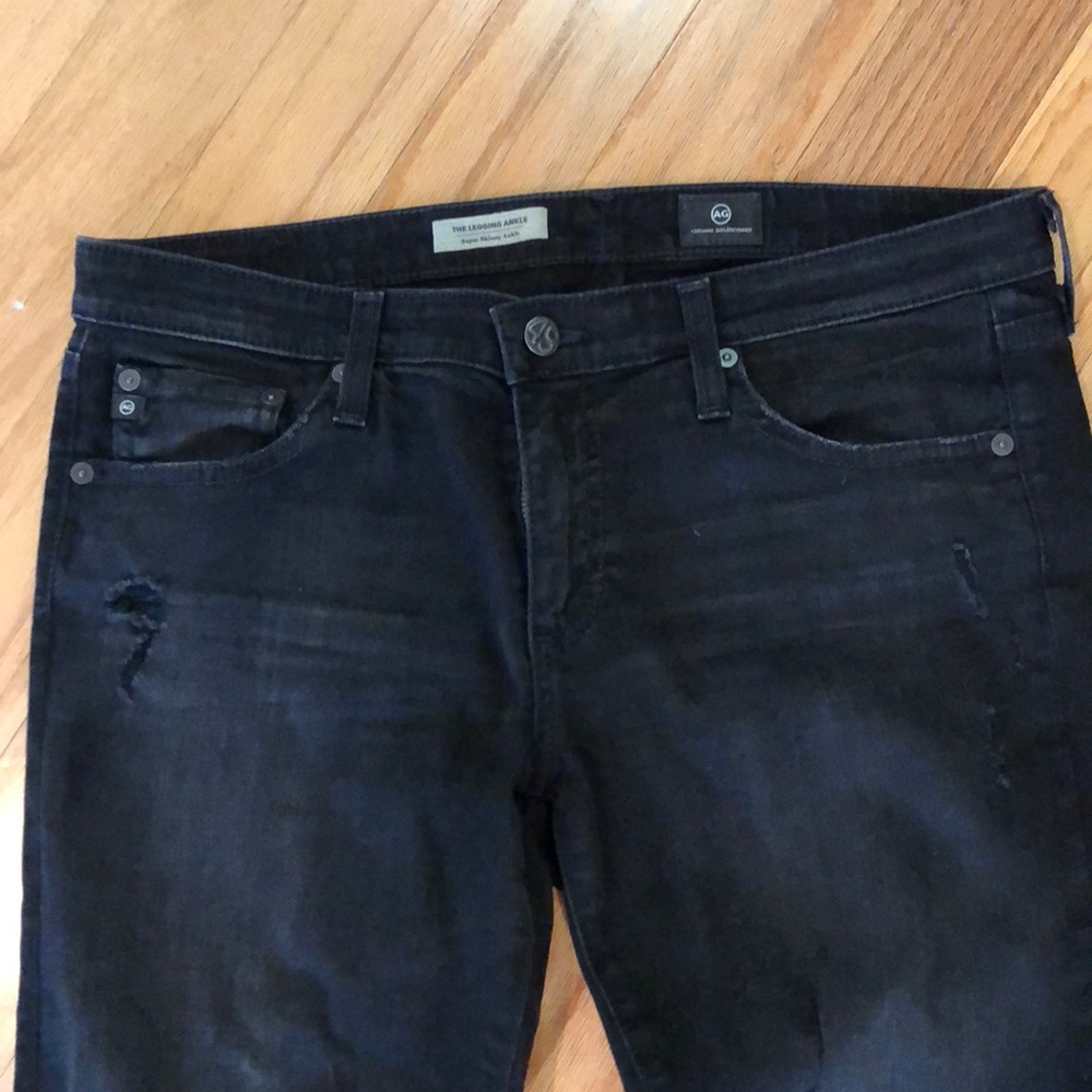 Distressed black AG skinny jeans. 31r